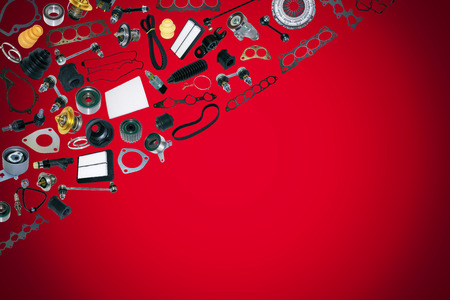Spare auto parts car on the red background. Set with many isolated items for shop or aftermarketの写真素材