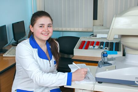 Young doctor girl with a folder of documents. Intern is the future physician treating people.