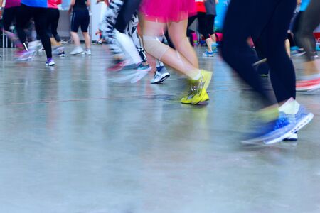 People make fitnes exercise. The image of the legs in sportswear.の写真素材