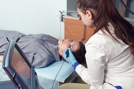 Checking eyesight in a clinic of the future, young girl. Ophthalmology. Future medicine and health...