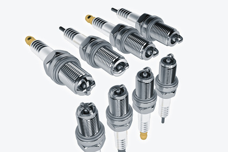 Spare parts spark plugs on white background for car and motorcycle. New auto parts spark plug. 3D...