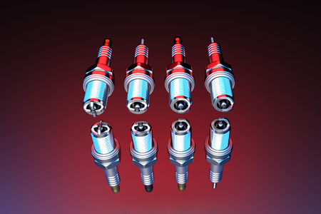 Spare parts spark plugs on multicolored background for car and motorcycle. New auto parts spark...