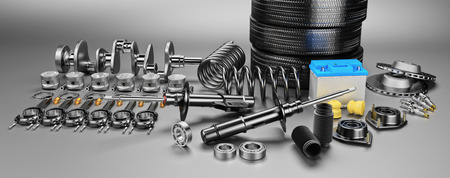 Auto parts spare parts car on the grey background. Set with many new items for shop or aftermarket....