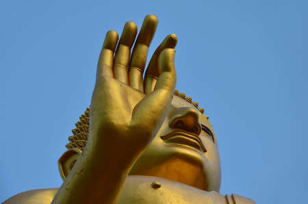 Buddha gold on a blue backgroundの写真素材
