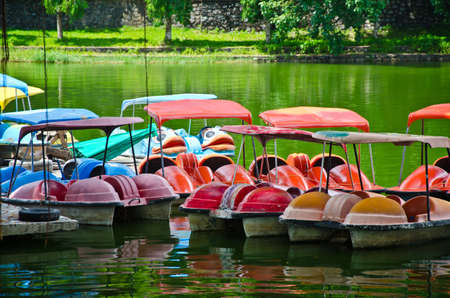 Group of colorful boats at the parkの写真素材