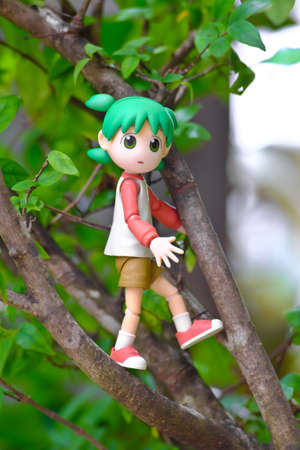 Yotsuba anime figure placed on outdoor nature with net on hand. Yotsuba models are also popular in...