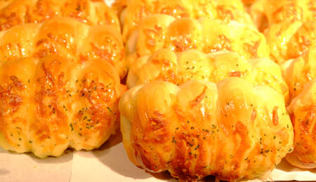 assortment of baked bread on wood table