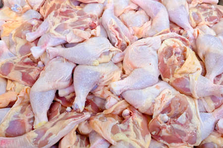 raw chicken legs on top of ice on sale in surpermarketの写真素材