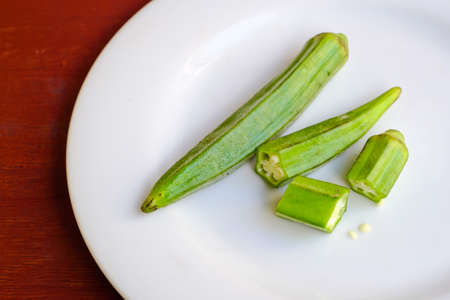 Okra on a white plateの写真素材