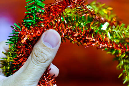 Hands clutching the rainbow christmasの写真素材