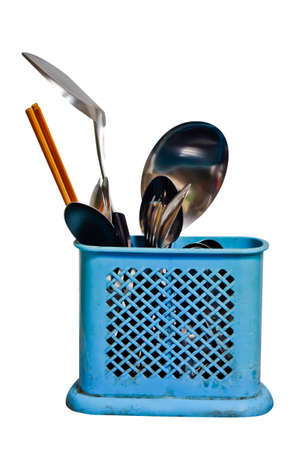 Kitchen appliances and utensils like chopsticks on a white background.の写真素材