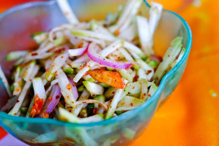 spicy mango salad with vegetable and chiliの写真素材