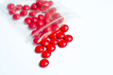 Close up of red drug on white backgroundの写真素材