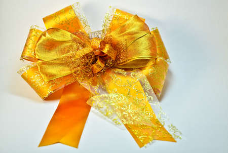 Gold Bow on a White Background (ribbon)