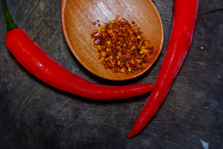 Cayenne pepper on wooden spoonの写真素材