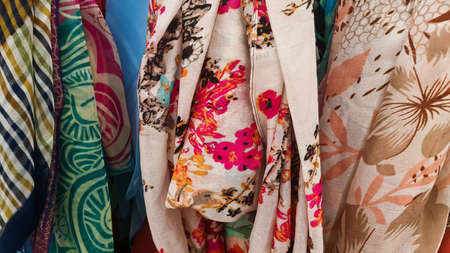 Close-up of colorful scarves hanging in the marketの写真素材