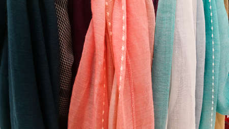 Close-up of colorful scarves hanging in the marketの写真素材