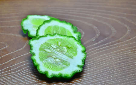 Lime wood plate on white background.の写真素材