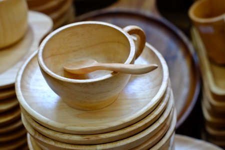 Round wooden tray with cups and wooden spoonsの写真素材
