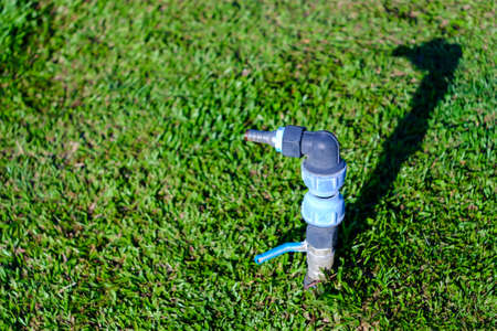 Faucet on the grass of green. in the park.の写真素材