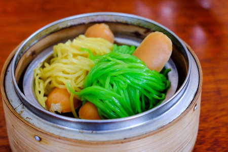 Chinese dim sum in bamboo steam containers (food)の写真素材