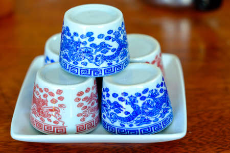 ceramic cups for the tea ceremony on rustic wooden tableの写真素材