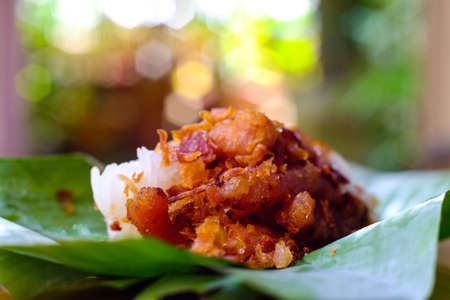 Sticky rice, pork wrapped in banana leaves.(bokeh background)の写真素材