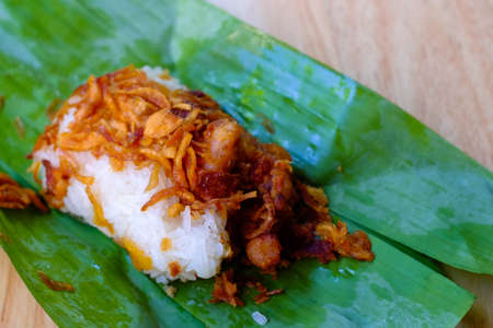 Sticky rice, pork wrapped in banana leaves.の写真素材