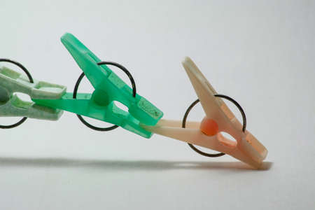 Sets color clothes-pegs over white background