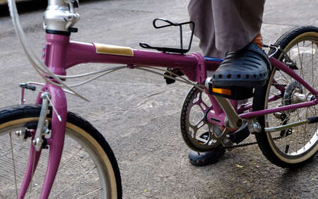 man riding a bicycle in park, (Folding Bicycles)