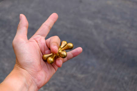 fidget spinner on hand with love. (Brass fidget spinner)