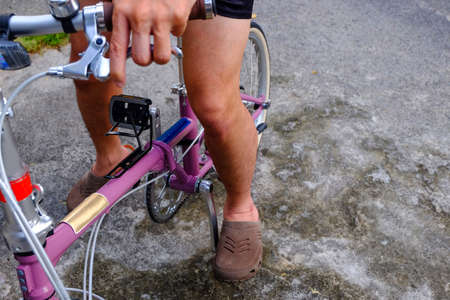man riding a bicycle in park, (Folding Bicycles)の写真素材