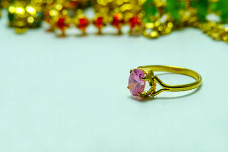 Gold ring with jewels a cute jewelry from nature (rose quartz)の写真素材