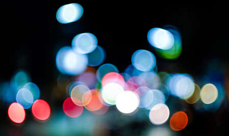 Abstract urban night light bokeh, defocused backgroundの写真素材