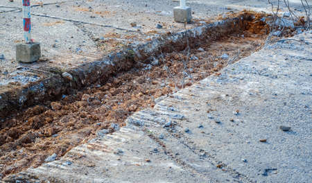 speed limit sign and hurdles in the road excavationの写真素材