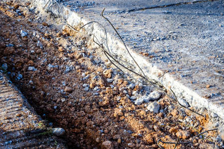 speed limit sign and hurdles in the road excavationの写真素材