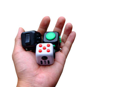 Fidget Cube stress reliever, fingers toy on isolated background. (relax)の写真素材