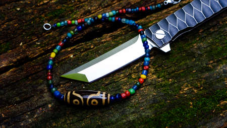 Tanto knife and pendant Amulet dZi Bead Tibet Styleの写真素材