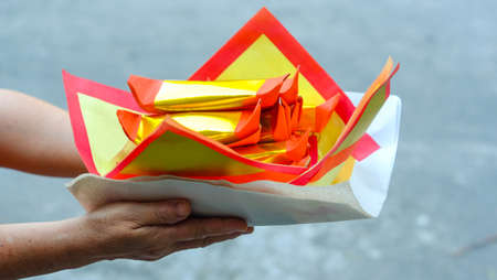Chinese Offering Paper, Chinese traditional for burning pay respect to god or passed away ancestor's spirits for Chinese ceremony.の写真素材