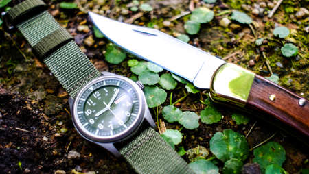 Knife and watch in the form of vintage. Knife for military operations.の写真素材