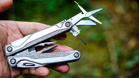 multi tool in a hand, Close up man hand using standard multimeter tools