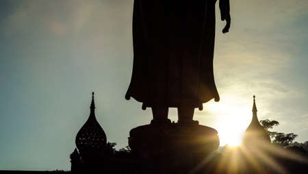 Buddha statue stood back in the evening light.の写真素材