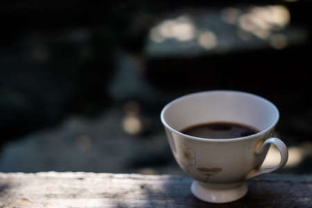 black hot coffee on nature background, hot coffee and smokeの写真素材