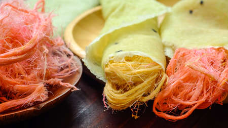 Thai cotton candy burrito pancake on wood background