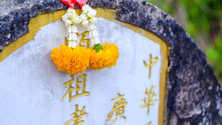 Songkhla, Thailand - APRIL 14, 2018 : Chinese culture traditional concrete tombs with Chinese memorial name is in the graveyard.のeditorial素材