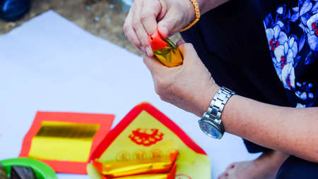 Songkhla, Thailand - APRIL 14, 2018 : Chinese Offering Paper, Chinese traditional for burning pay respect to god or passed away ancestor's spirits for Chinese ceremony.のeditorial素材