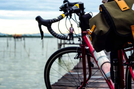 riding a bicycle in the countryside, with blue sky and sunsetの写真素材