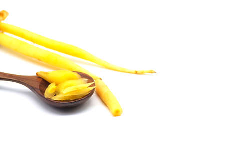 finger root with Sliced in wooden spoon isolated on white background. thai herb.