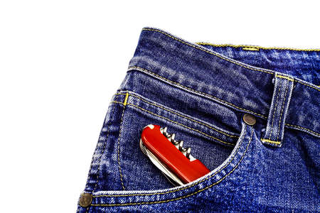 Denim blue jeans fabric with multitool. Ripped denim blue cloth background, text place, copy space....