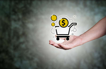 businessman holding cart shopping coins concept. Big data analytics and business intelligence concept. composition concept of global business.Digital link tech.の写真素材